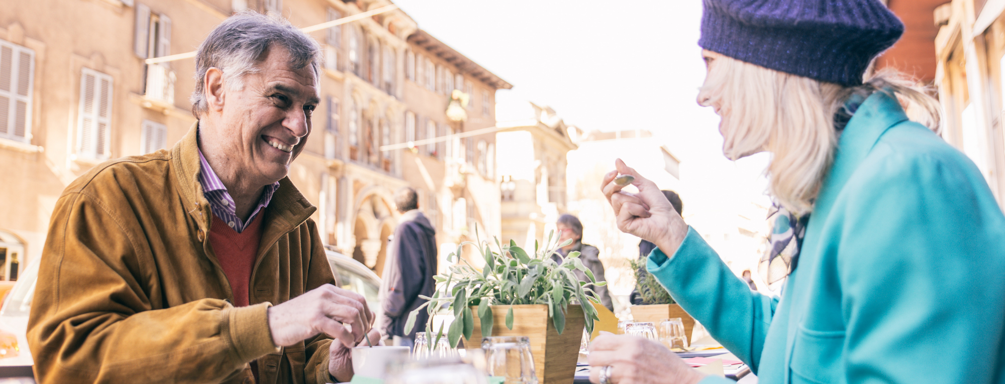 Couple relaxing over breakfast in European cafe